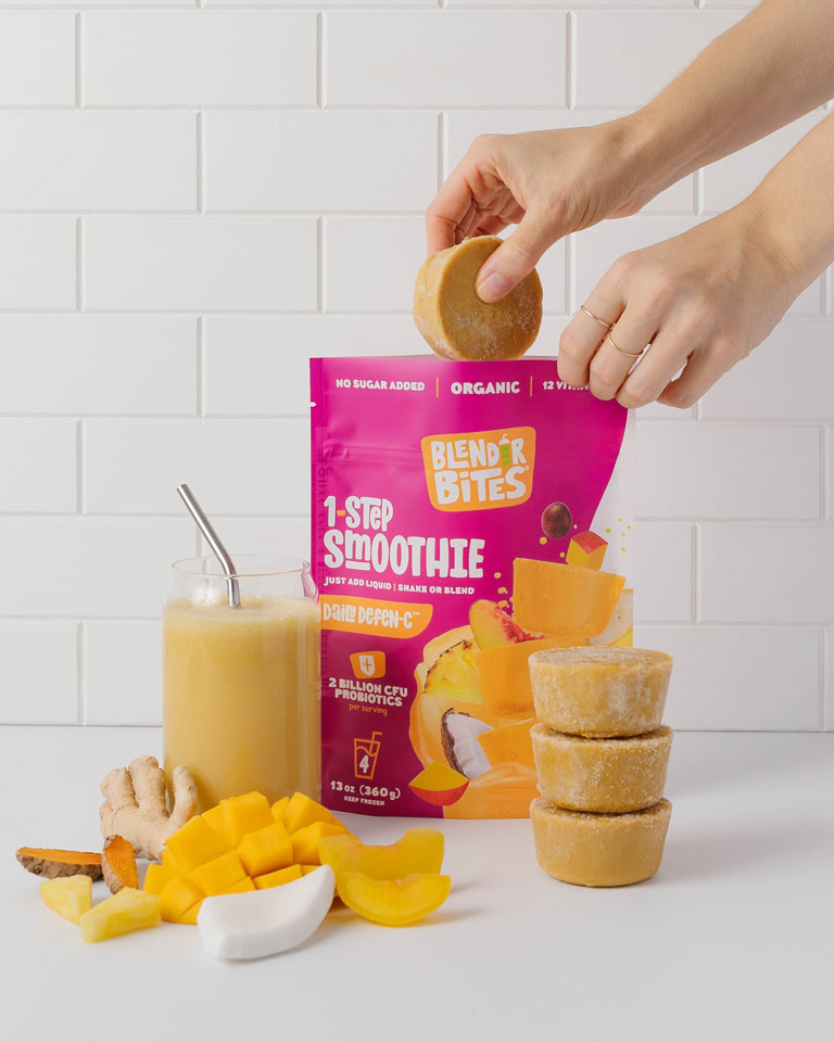 Daily Defen-c smoothie pucks being taken out of pouch Daily Defen-c smoothie pucks being taken out of pouch